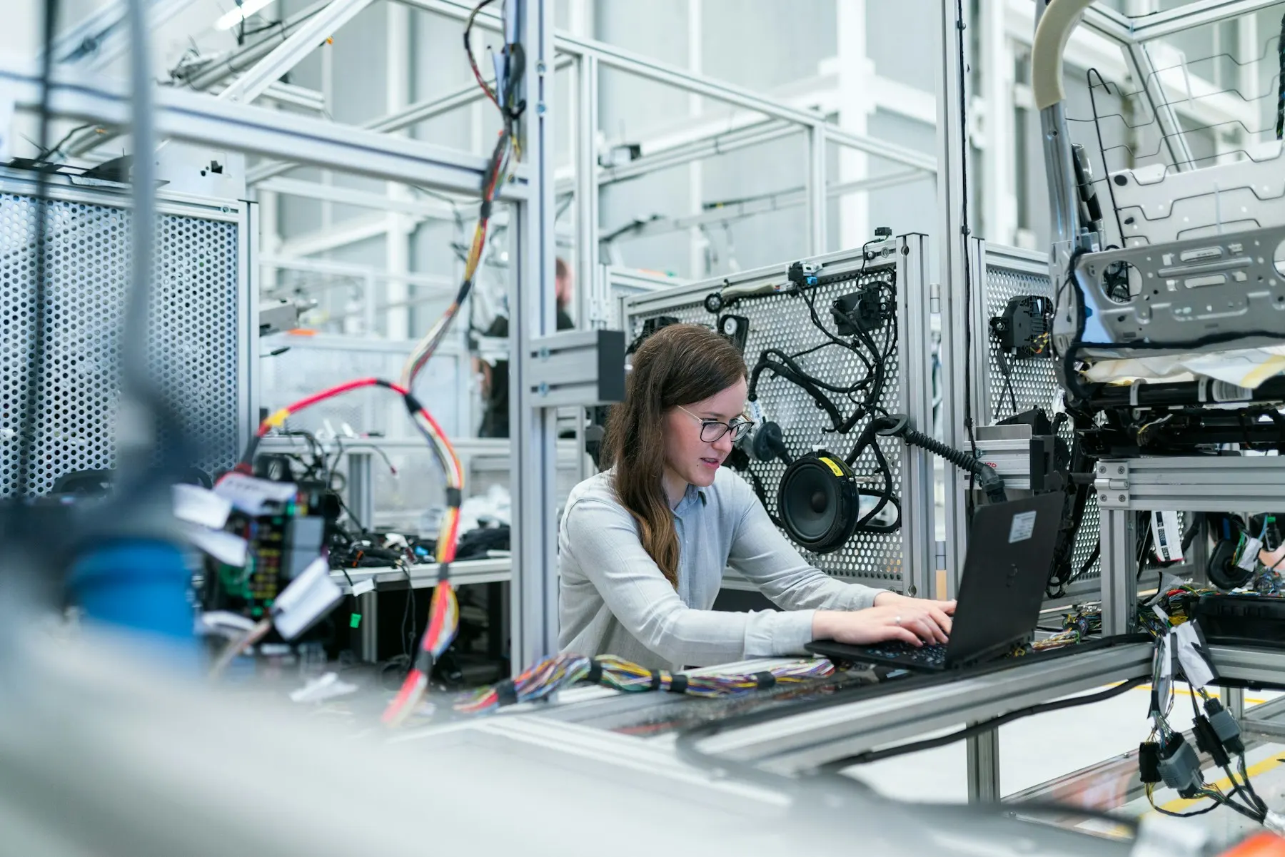 Technician on a bright factory floor